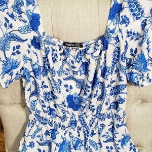 A white dress with blue pattern